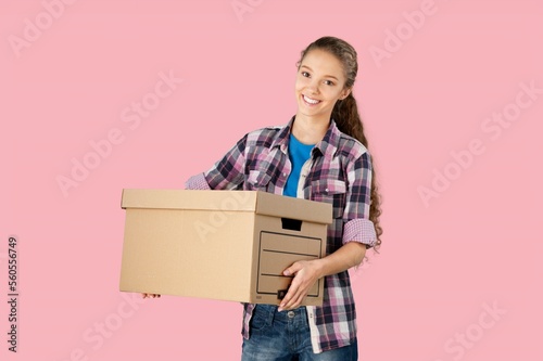 Beautiful happy woman delivery courier posing on background