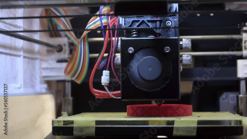 3D Printer with Red Filament photo