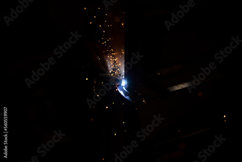 Metal welding in dark High temperature heating steel. Metal lights.