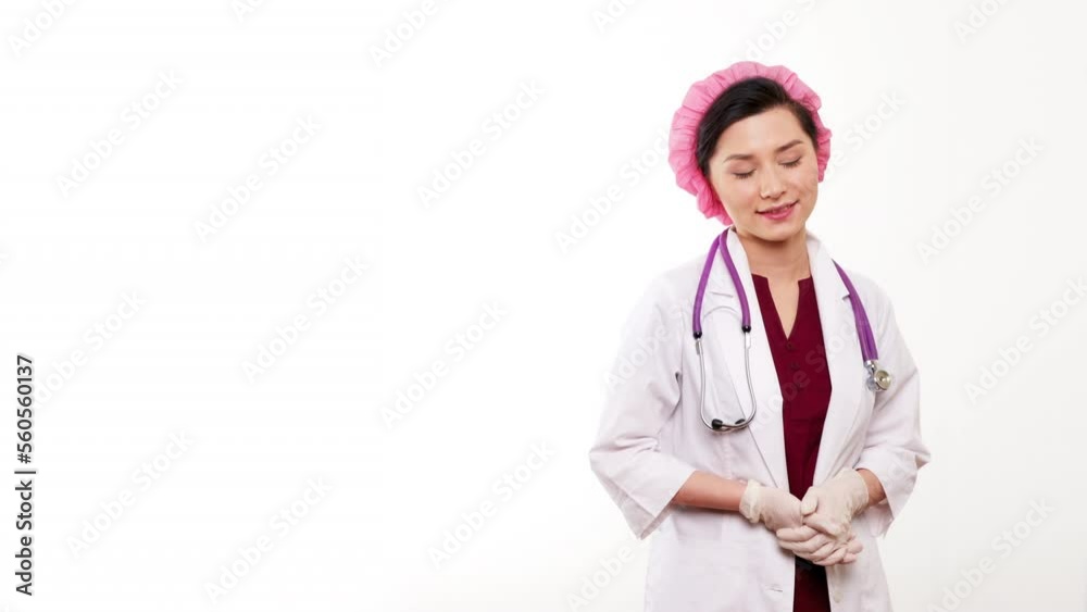 Smiling Asian Female Health Care Worker Looking at Camera. Portrait Close Up Doctor Nurse Wearing Protective Mask and white coat in hospital. Medicine healthcare concept. Corona Virus Disease COVID Smiling Asian Female Health Care Worker Looking at Camera. Portrait Close Up Doctor Nurse Wearing Protective Mask and white coat in hospital. Medicine healthcare concept. Corona Virus Disease COVID