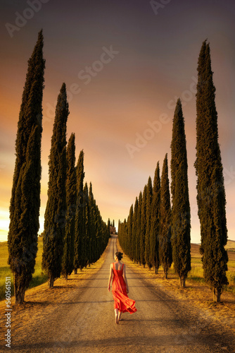 Obraz na płótnie Woman in red dress in Tuscany taken in May 2022 w salonie