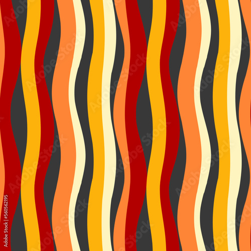 Wide wavy stripes of red, orange, yellow color. Seamless vector image.