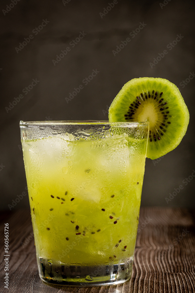 Brazilian Kiwi Caipirinha. Cachaça drink with kiwi, on wooden background. Brazilian Kiwi Caipirinha. Cachaça drink with kiwi, on wooden background.