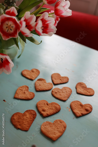Bouquet of tulips and heart-shaped cookies on the table .Valentines  mothers  womens day  wedding or birthday flat lay concept. Top view.