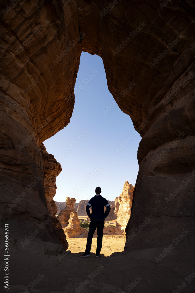 Hiker in rock window taken in May 2022