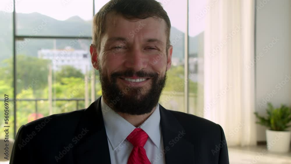 Smiling bearded male happy professional businessman looking at camera. Happy confident handsome smart senior adult entrepreneur, leader, manager posing in office. Close up face view business portrait Smiling bearded male happy professional businessman looking at camera. Happy confident handsome smart senior adult entrepreneur, leader, manager posing in office. Close up face view business portrait