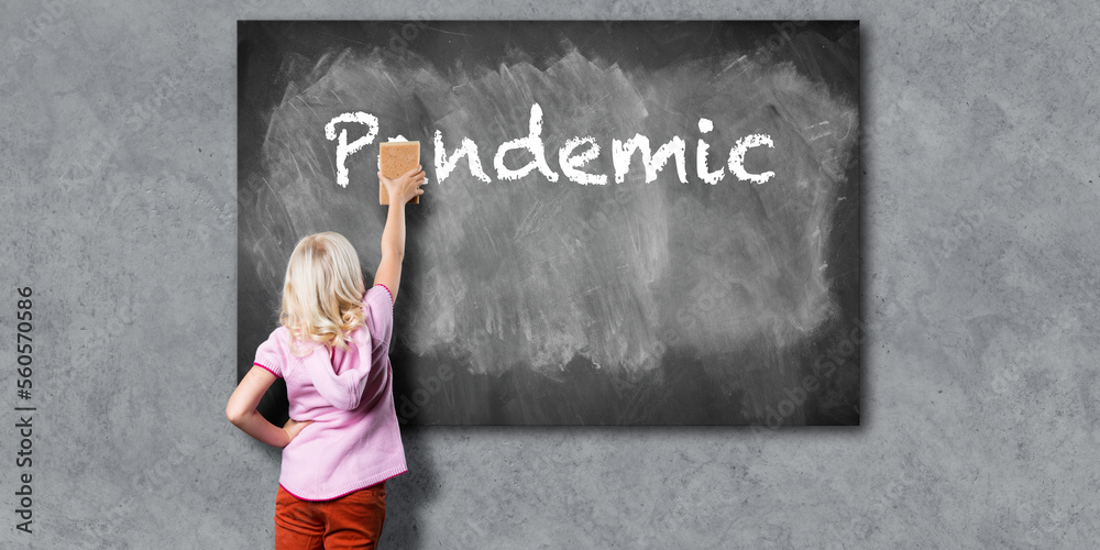 a young girl with a sponge, erasing the word pandemic from a blackboard a young girl with a sponge, erasing the word pandemic from a blackboard