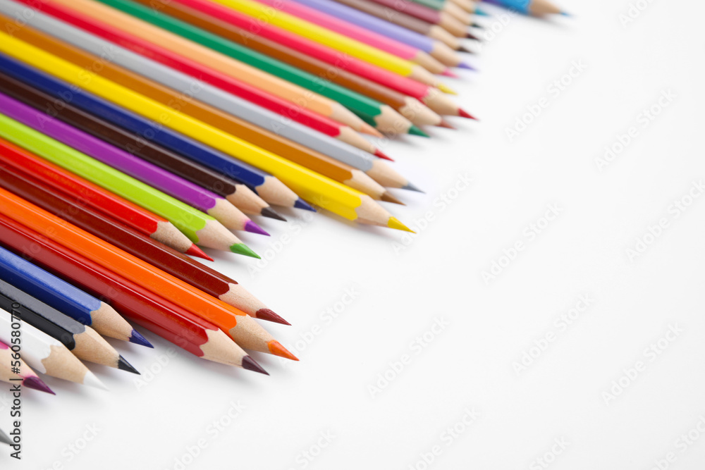 Colorful wooden pencils on white background, space for text