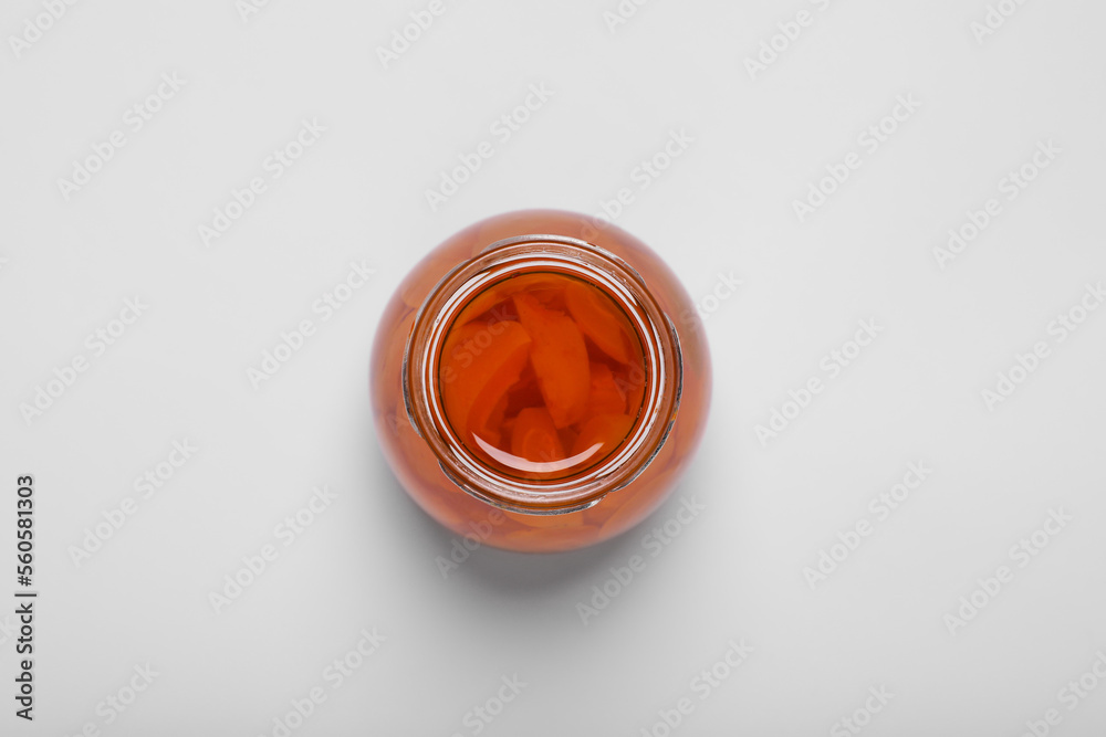 Tasty canned sliced apricots on white background, top view Tasty canned sliced apricots on white background, top view