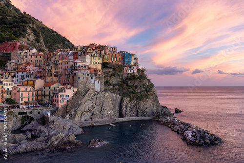 Small touristic town on the coast, Manarola, Italy. Cinque Terre. Colorful Sunny Sunset Fall Season.