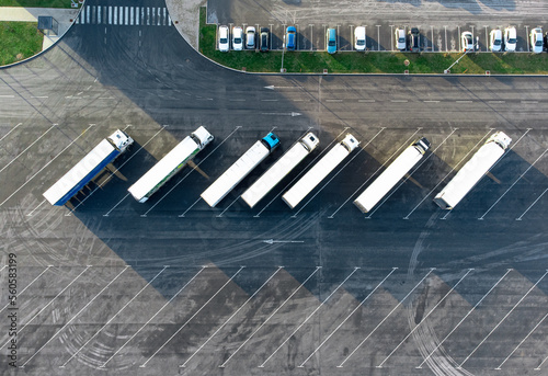 Aerial view of trucks parked in the parking lot. Directly above, top down view