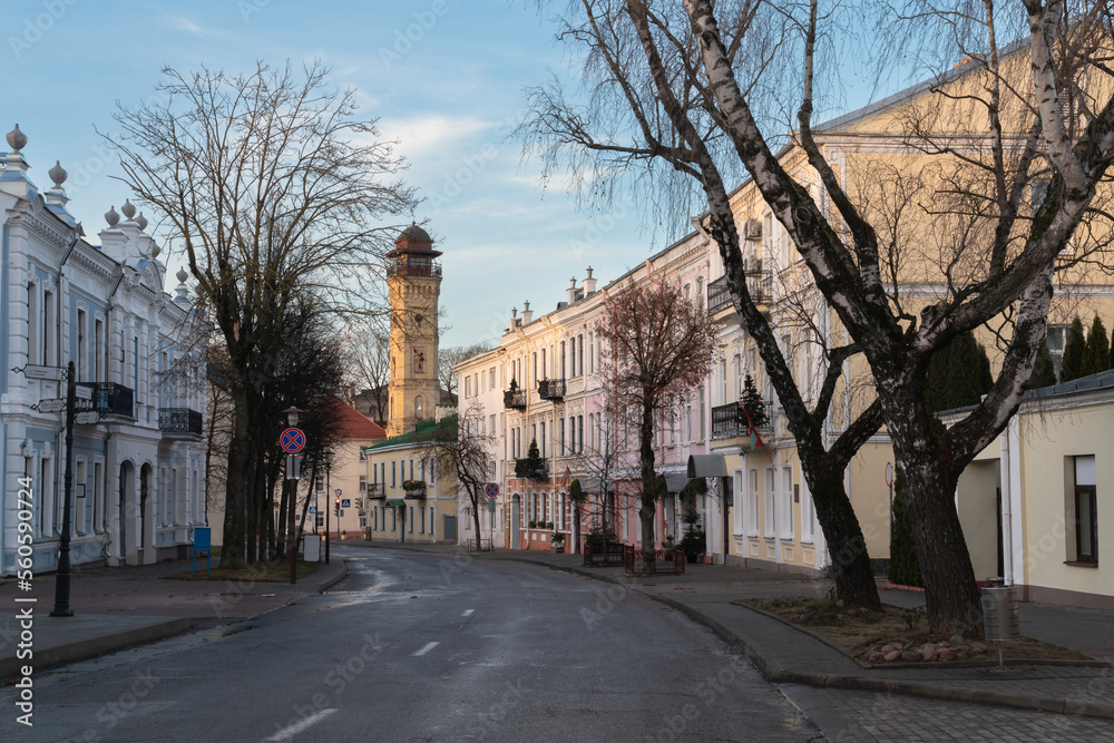 View of an old street in the historical center of the city and a fire tower in the background, Grodno, Belarus