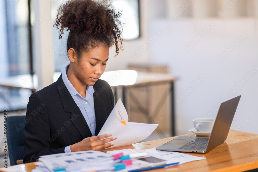 Young African American businesswoman wotk, black woman in afro hair business woman working on laptop and do document, tax, exchange, finance, accounting, Young African American businesswoman wotk, black woman in afro hair business woman working on laptop and do document, tax, exchange, finance, accounting,