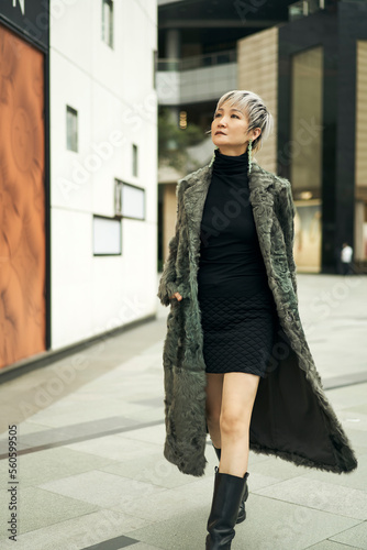 fashion Asian beauty wearing fur walking on street