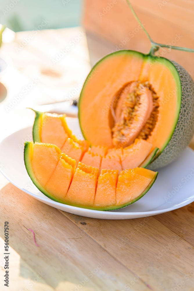 piece of fresh orange melon on the plate