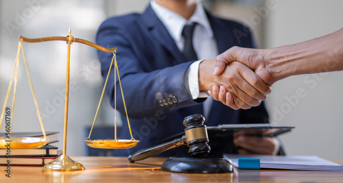 Businessman handshake to seal a deal Judges male lawyers justice and law concept. male lawyer working in office. Legal law, advice and justice concept.