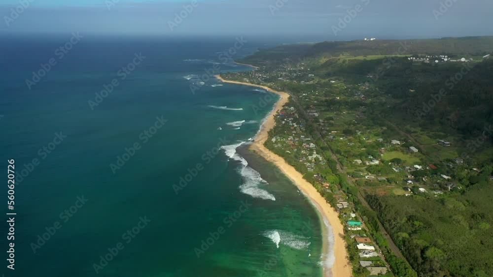 Aerial Scenic View Of Beach Amidst Sea And Green Land, Drone Flying Backwards On Sunny Day - Oahu, Hawaii Aerial Scenic View Of Beach Amidst Sea And Green Land, Drone Flying Backwards On Sunny Day - Oahu, Hawaii