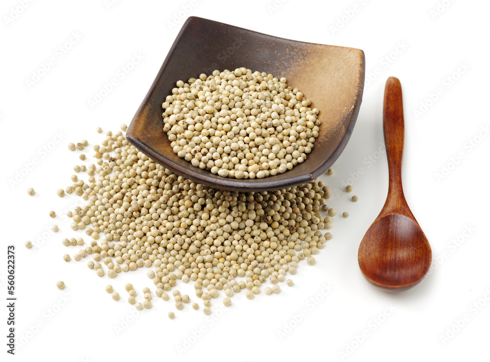 White peppercorns on white background White peppercorns on white background