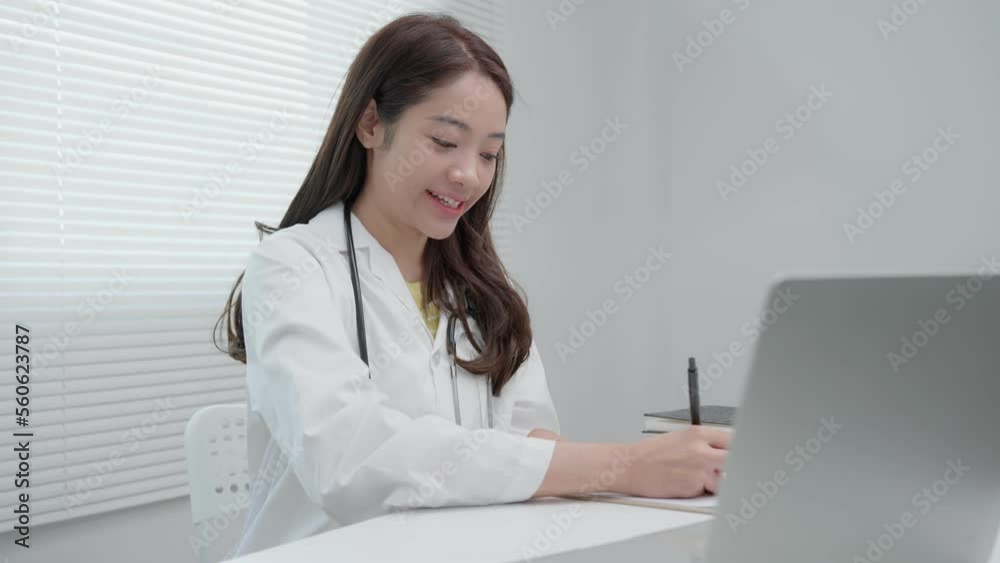 tele-medical. Doctor explains the medication to the patient by video conference. Asian doctor is treating patients through telecommunication while describing the disease . Technology for health. tele-medical. Doctor explains the medication to the patient by video conference. Asian doctor is treating patients through telecommunication while describing the disease . Technology for health.