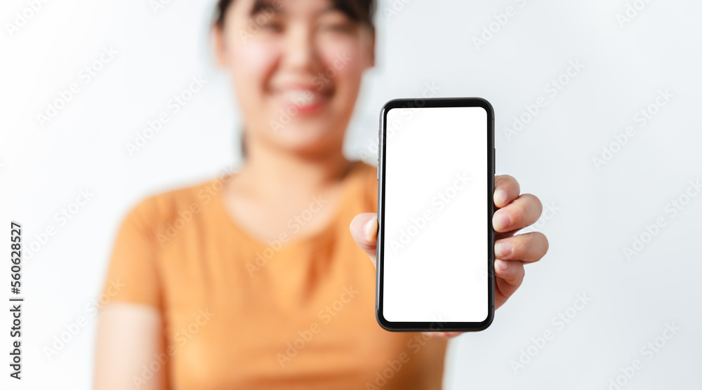 Woman hand holding blank empty white screen smart phone.