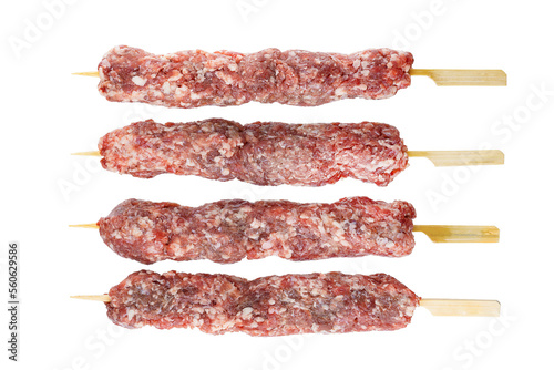 Beef or lamb meat raw kebab on skewers isolated on white background. With clipping path. Full depth of field. Focus stacking