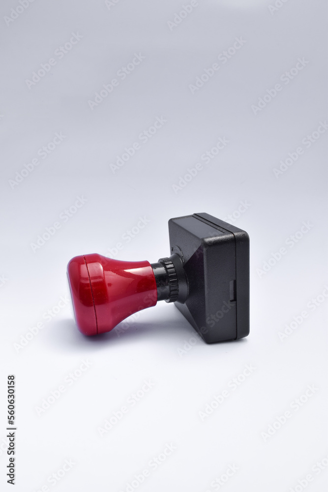Plastic Red Rubber Stamper Isolated on White Background Plastic Red Rubber Stamper Isolated on White Background