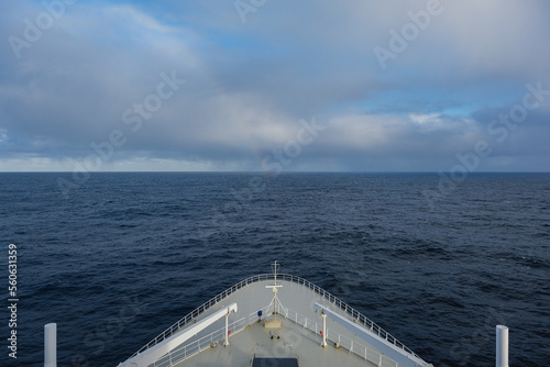 Rainbow at sea after storm during transatlantic passage on legendary ocean liner cruiseship cruise ship on Atlantic Ocean with cloud and seascape photo