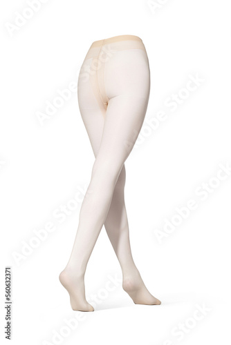 Detailed shot of beige tights with a color print imitating tattoo at the side. The tattoo-effect pantyhose have a shape of walking women's legs. The clothes are isolated on a white background.