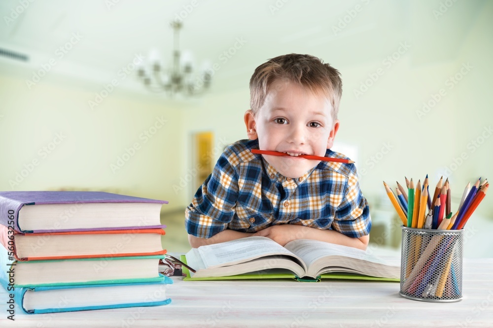 Cute small school child studying at class Cute small school child studying at class