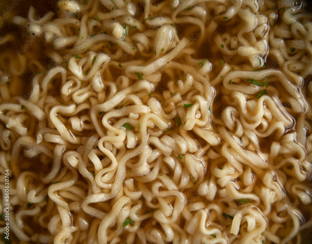ramen noodles close-up. broth ramen macro photo. Asian instant noodles with spices soaked in water