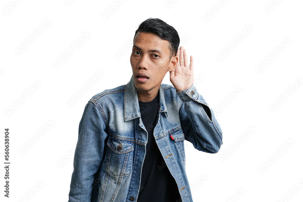 Asian man wearing blue jean jacket expression surprised hearing something. Hand on ear, isolated on white background Asian man wearing blue jean jacket expression surprised hearing something. Hand on ear, isolated on white background