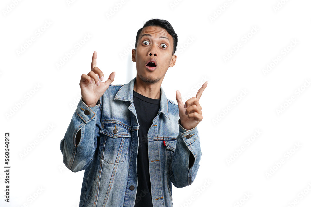 asian man wearing blue jean jacket with excited surprised gesture, isolated on white background asian man wearing blue jean jacket with excited surprised gesture, isolated on white background