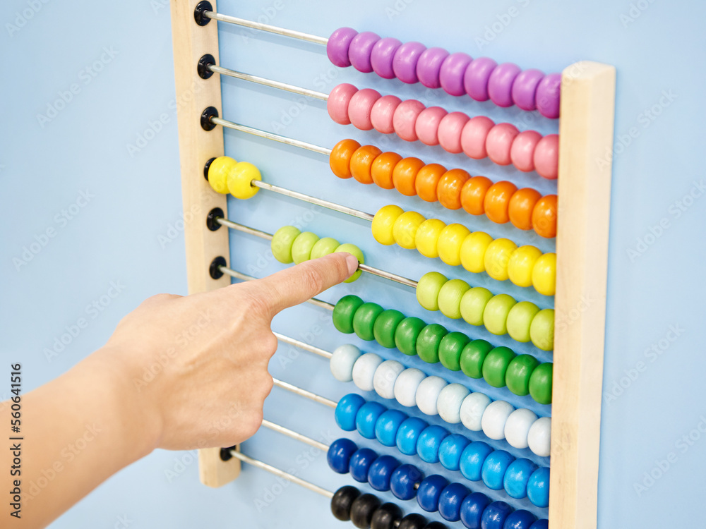 Hand and colored kids learning abacus Hand and colored kids learning abacus