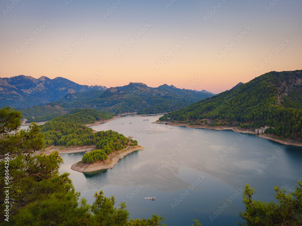 travel around turkey, Burdur region. Karacaoren lake and mountains aerial view landscape in Turkey at sunset. Forest island in turquoise water scenery wild nature travel beautiful destinations