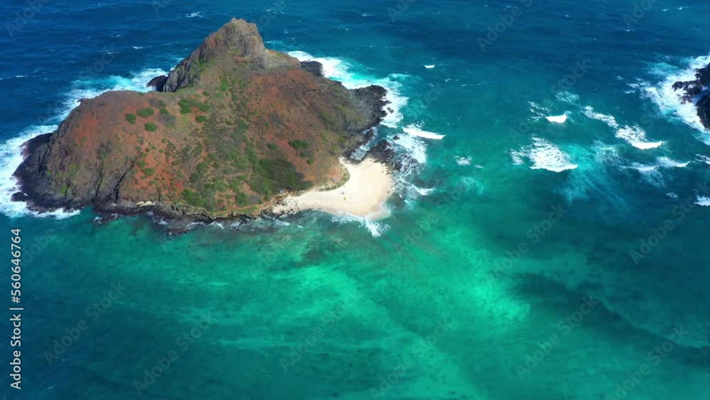 Aerial Panning Scenic Shot Of Island Beach Amidst Ocean During Sunny Day - Waikiki, Hawaii Aerial Panning Scenic Shot Of Island Beach Amidst Ocean During Sunny Day - Waikiki, Hawaii