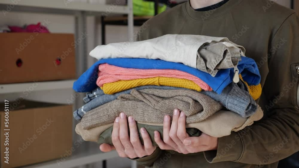 Donating old clothes to charity or recycling. Clothing and Textile