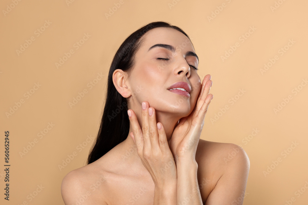 Portrait of attractive young woman on beige background. Spa treatment Portrait of attractive young woman on beige background. Spa treatment