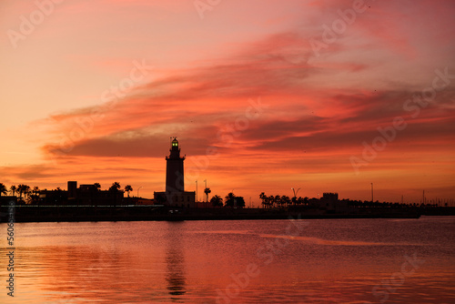 Lighthouse in Malaga at sunrise.