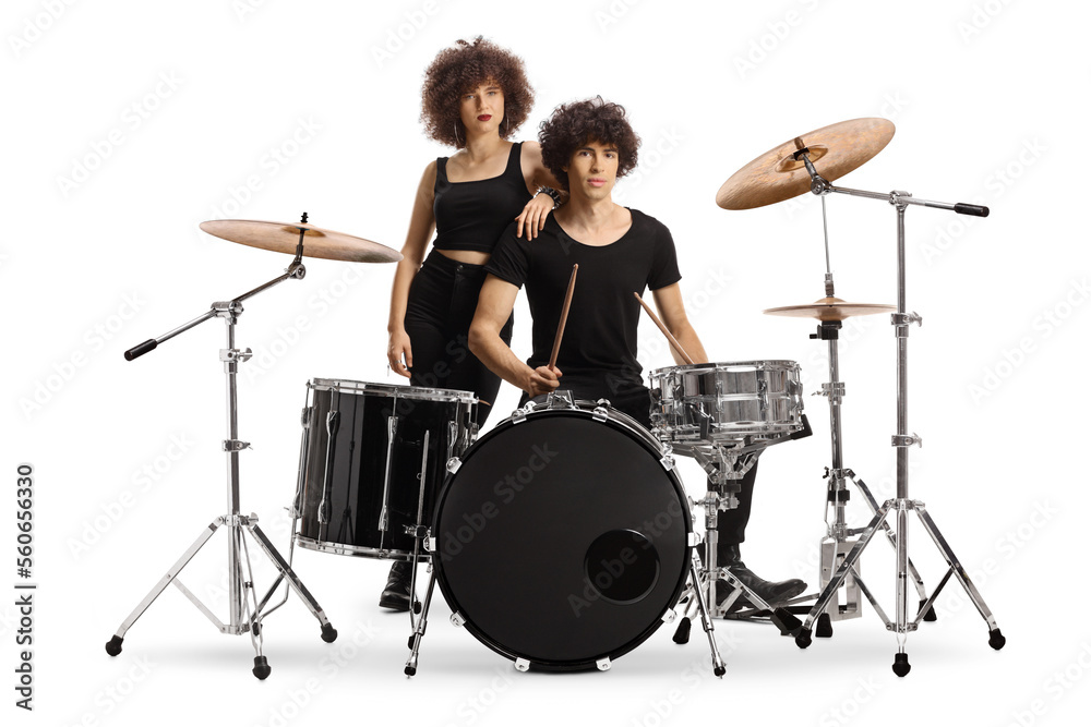 Fototapeta premium Male and female drummers posing with a drum kit