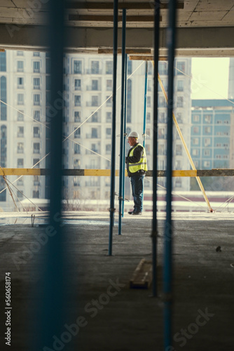 the architect checks the work on the construction site