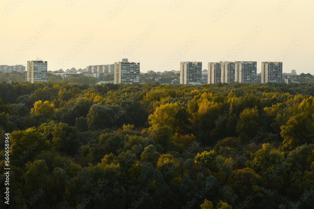 New Belgrade city skyline over the Great War Island forest in sunset