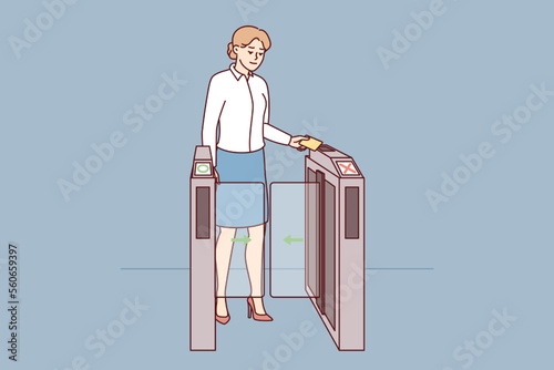 Woman in business clothes is applying pass to go through turnstile at entrance to office. Businesslady holds magnetic card giving access to office space with workplace. Flat vector image photo