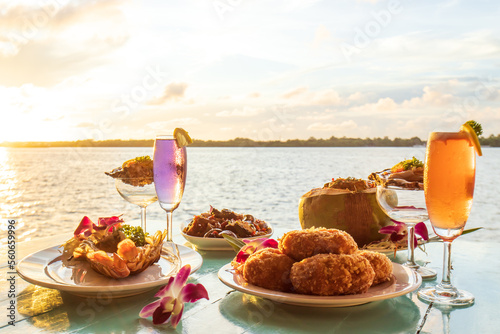 Thai cuisine set with a waterfront restaurant at sunset.