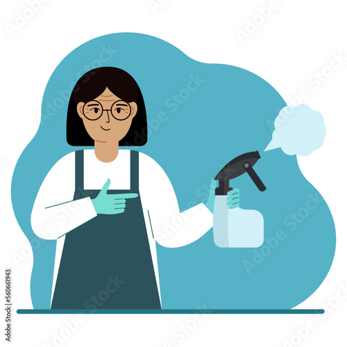 A woman in gloves holds a spray bottle with disinfectant liquid, antiseptic or detergent. Home disinfection and hygiene.