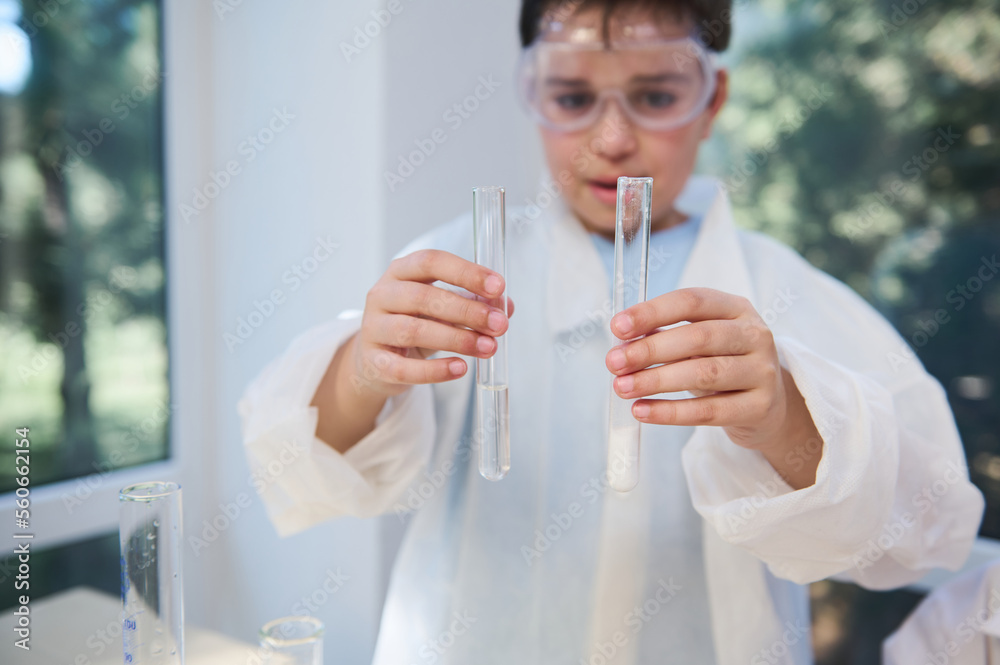 Selective focus on test tubes with chemicals and reagents, in the hands ...
