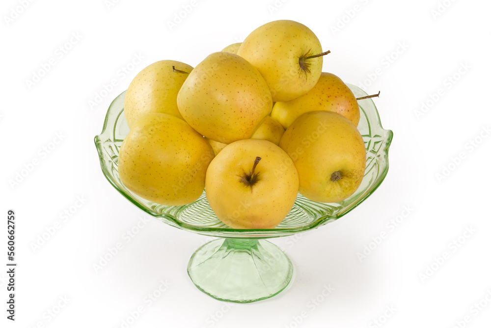 Yellow apples in the vintage glass vase for fruits