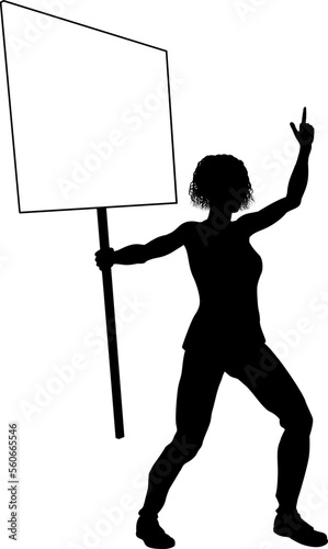 Protestor or demonstrator at a demonstration march, picket line or strike protest rally in silhouette. Holding up a banner or picket sign board placard.