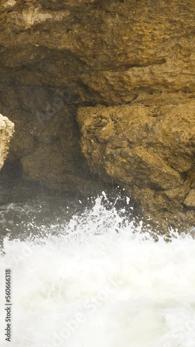 Athlantic Ocean waves in Portugal breacking agains the rocks and cliffs (Arrifes, South Portugal) photo