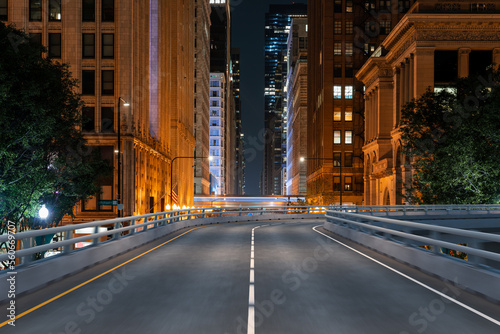 Empty urban asphalt road exterior with city buildings background. New modern highway concrete construction. Concept of way to success. Transportation logistic industry fast delivery. Chicago. USA.