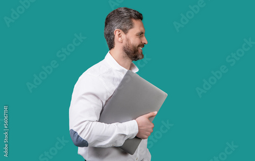 smiling businessman freelance with computer. businessman freelance holding laptop